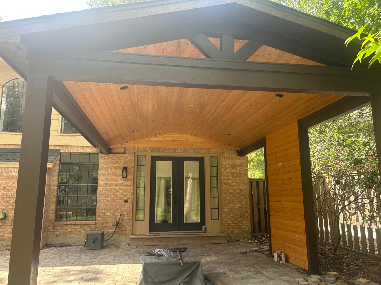 Attached gable roof patio cover with vaulted tongue-and-groove ceiling